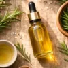 Rosemary oil for face displayed with fresh rosemary leaves for natural skincare benefits